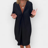 Vestido elegante com decote em V e bainha decorativa